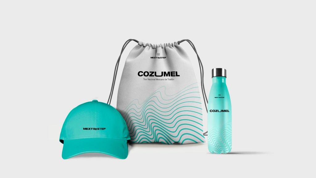 Kit for the triathletes: a teal baseball cap, drawstring bag and tumbler