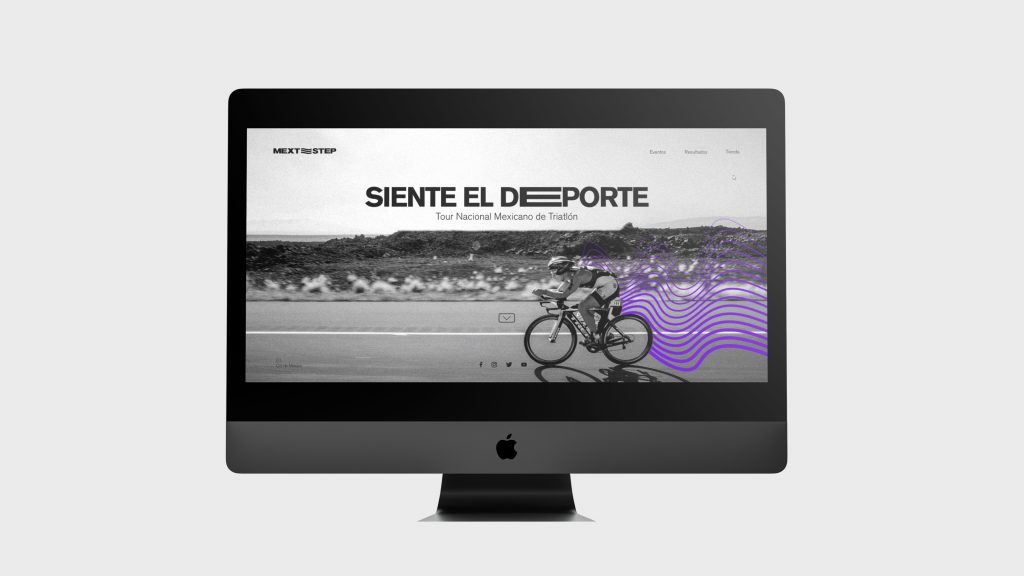 iMac with image of person on a bike, with slogan of the brand MEXT STEP